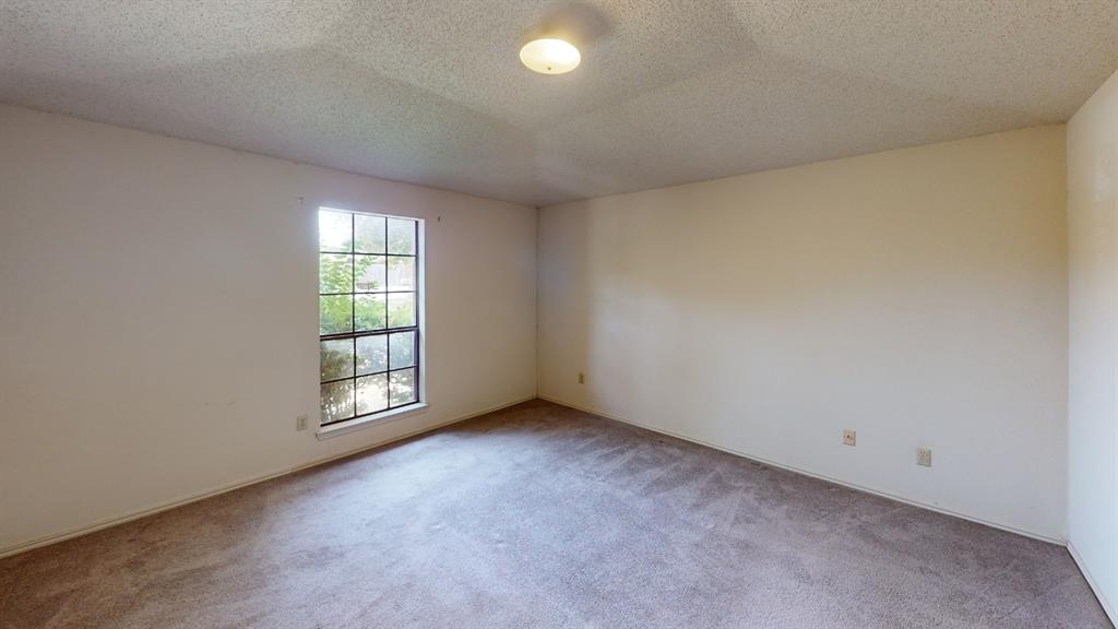 853 West Wintergreen Road Lancaster, TX 75134 - Photo 9 of 20 Carpeted room with a multi-pane window and a ceiling-mounted light fixture