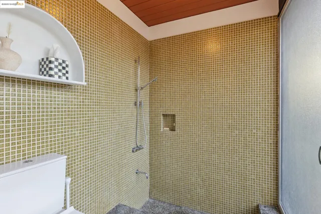 a view of a hallway with wooden floor and stairs