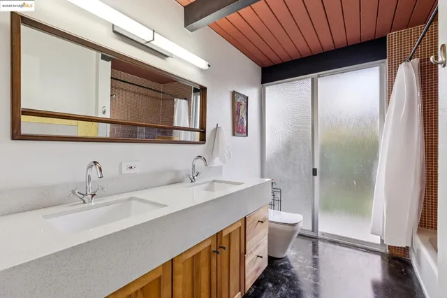 a bedroom with a bed and a chair