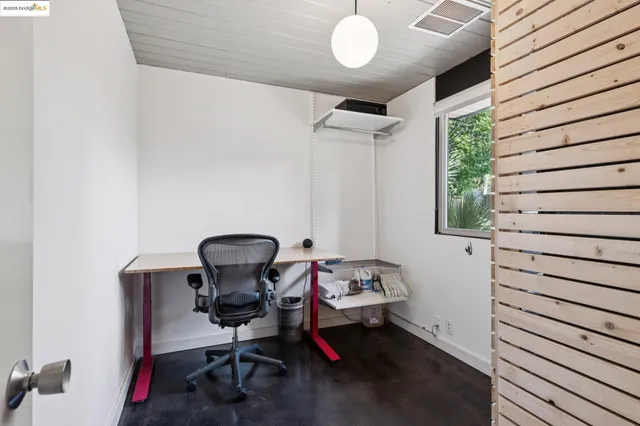 a view of a backyard with sitting area