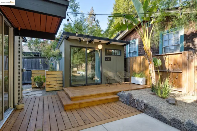 a view of a backyard with sitting area