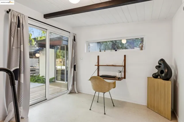 a swimming pool with outdoor seating and yard