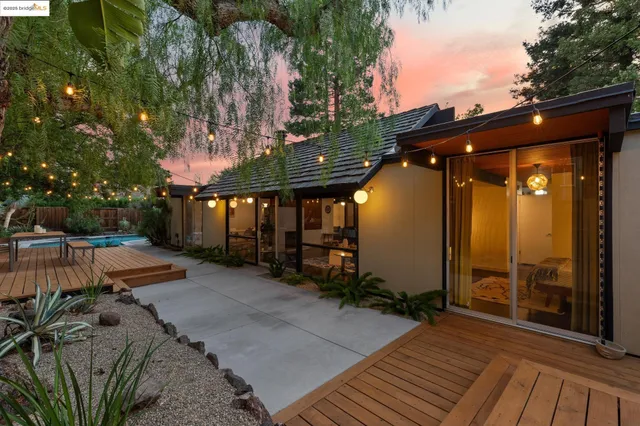 a view of a house with a backyard
