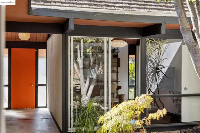 a living room with fireplace furniture and a wooden floor