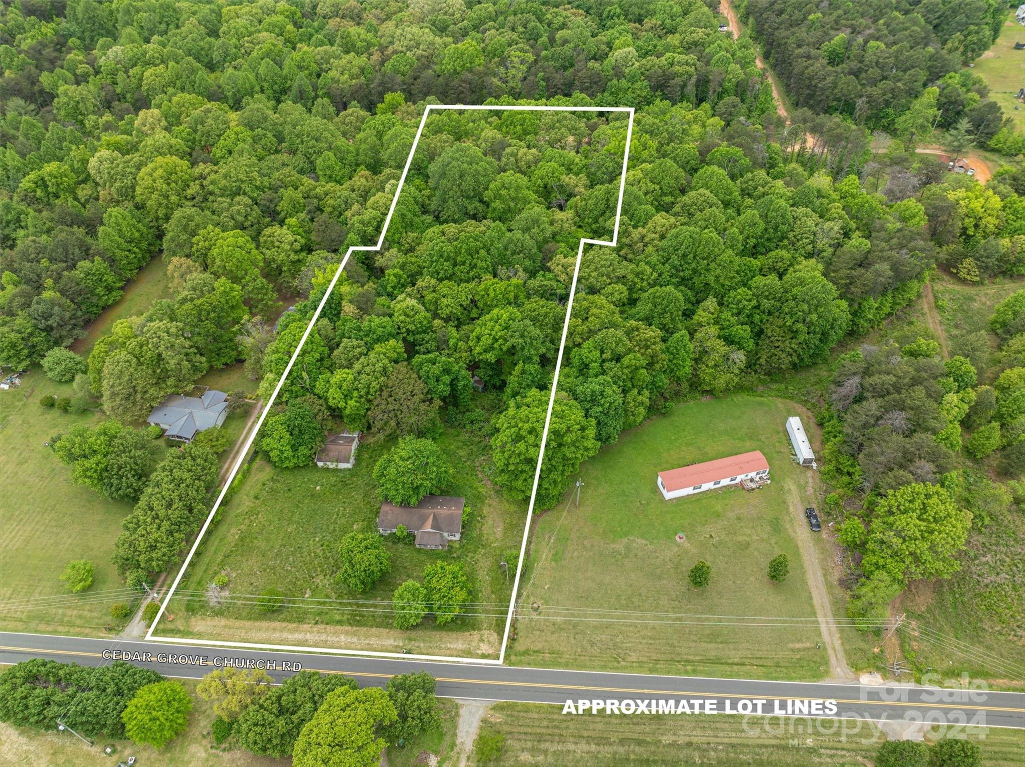 733 Cedar Grove Church Road Vale, NC 28168 - Photo 1 of 9 a view of a back yard