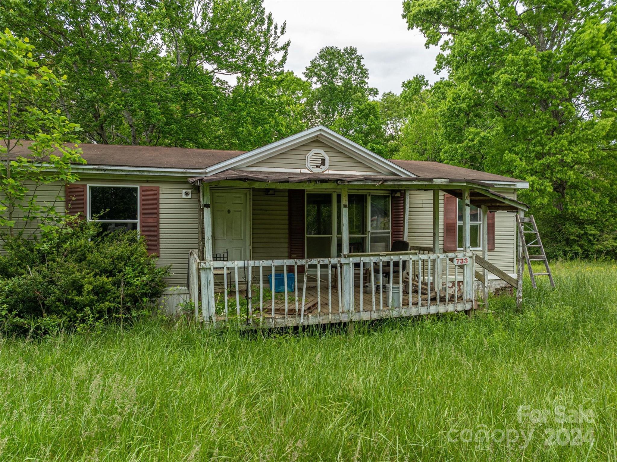 733 Cedar Grove Church Road Vale, NC 28168 - Photo 4 of 9 a front view of a house with a garden
