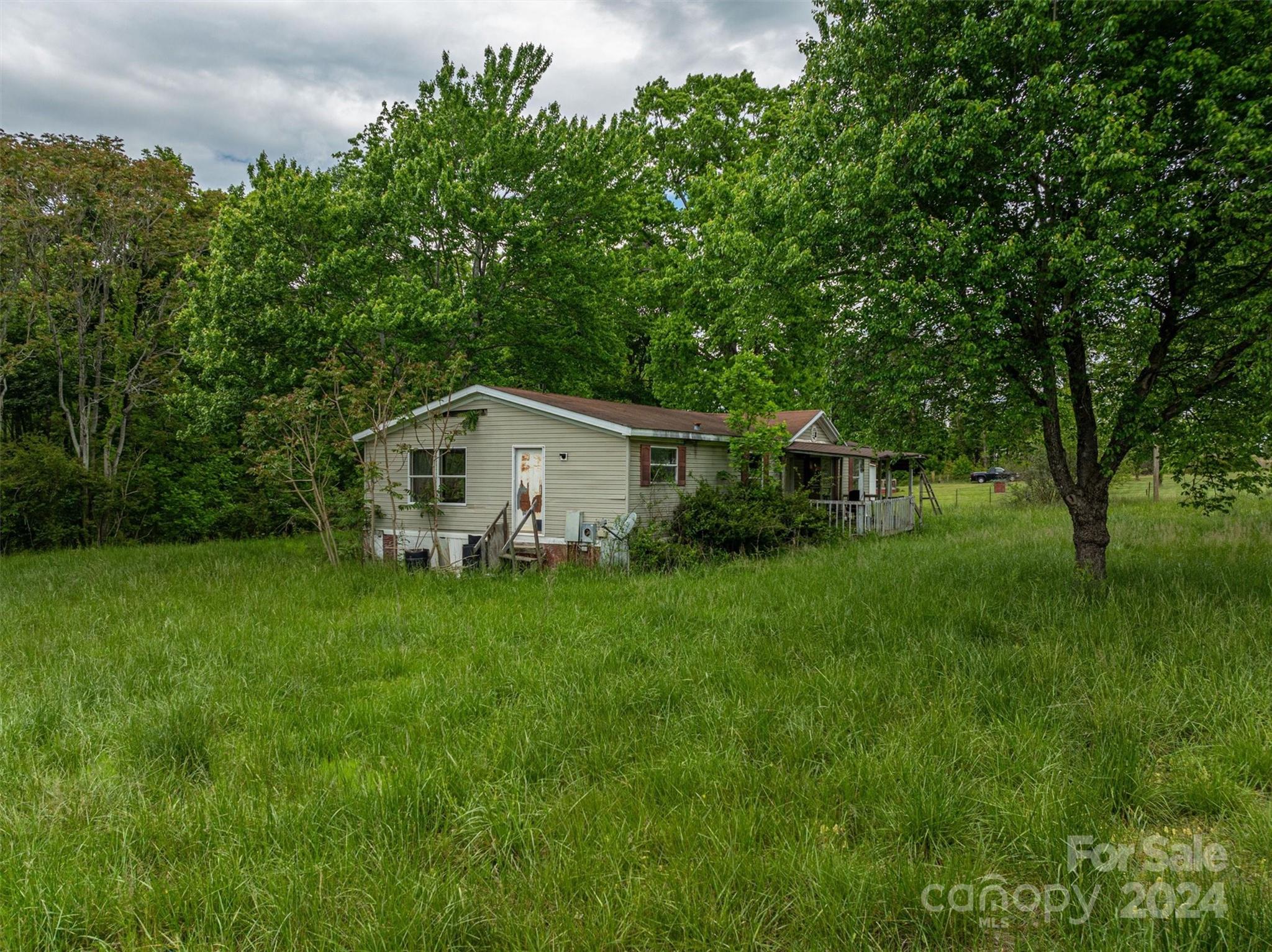 733 Cedar Grove Church Road Vale, NC 28168 - Photo 6 of 9 a house view with a garden space