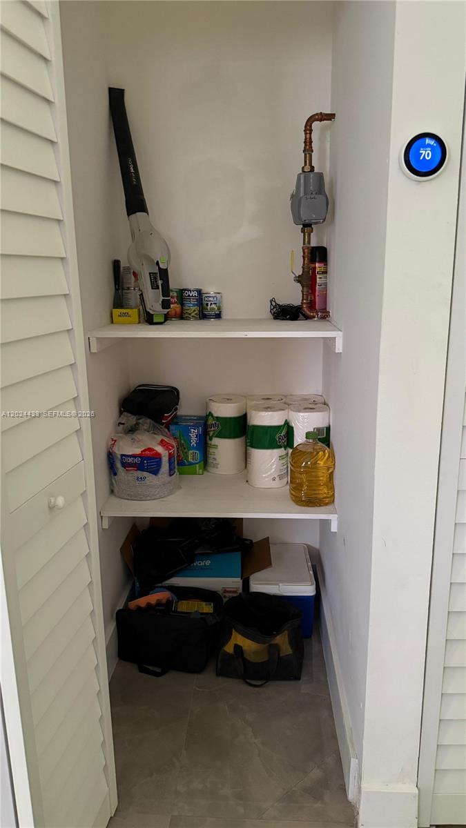 13675 Southwest 62nd Street, Unit 2023 Miami, FL 33183 - Photo 21 of 22 a room with storage and utility