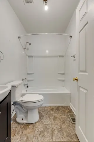 a bathroom with a sink a toilet and a bathtub