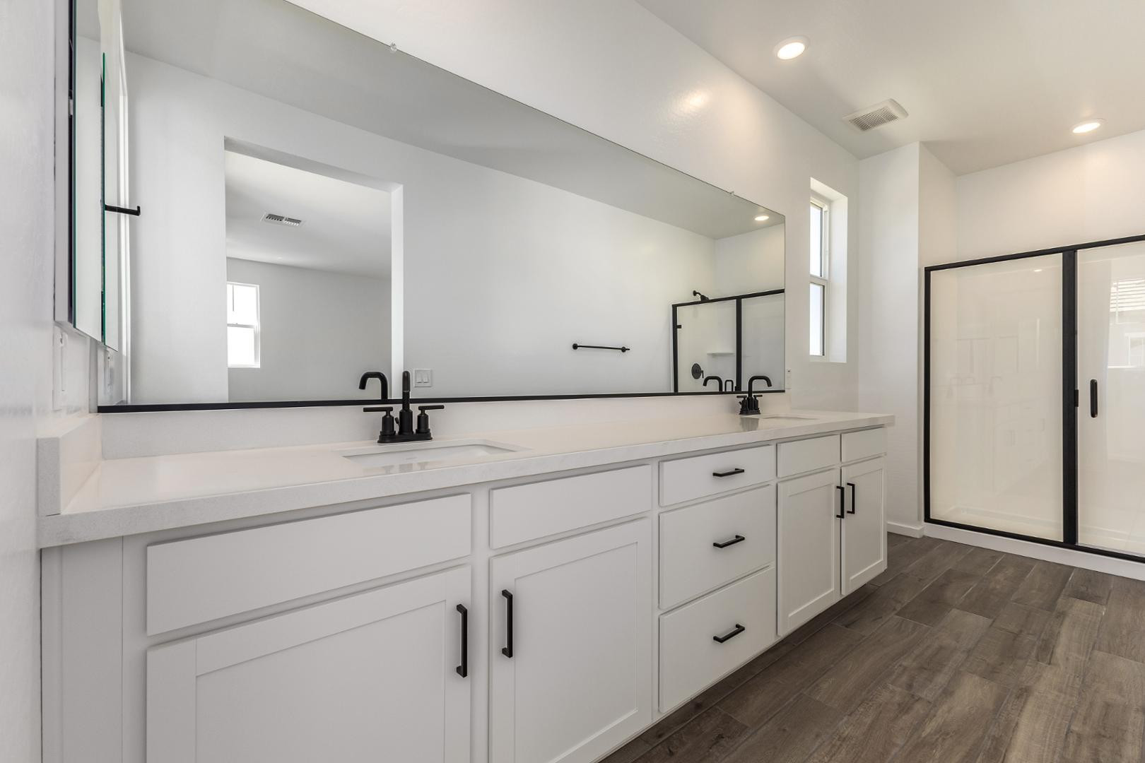 2434 West Maximo Way Phoenix, AZ 85085 - Photo 12 of 35 a bathroom with a double vanity sink and mirror