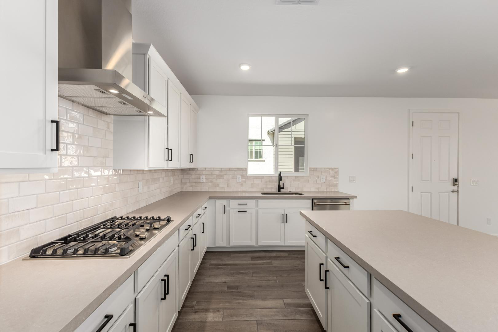 2434 West Maximo Way Phoenix, AZ 85085 - Photo 15 of 35 a kitchen with a sink stove and cabinets
