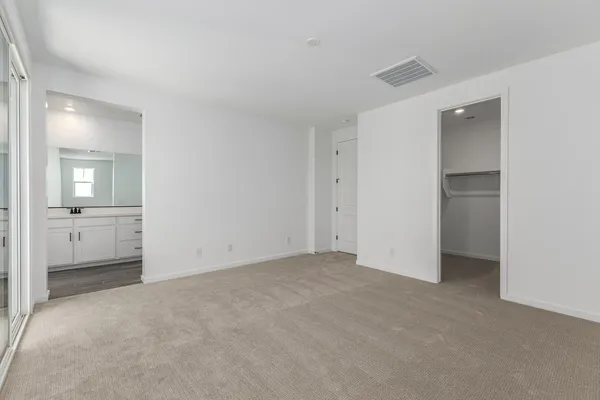 a bathroom with a sink a toilet and a window