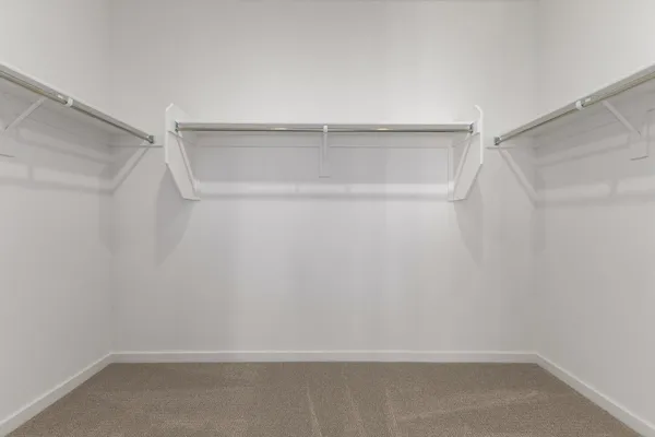 a small space with a window and a fan