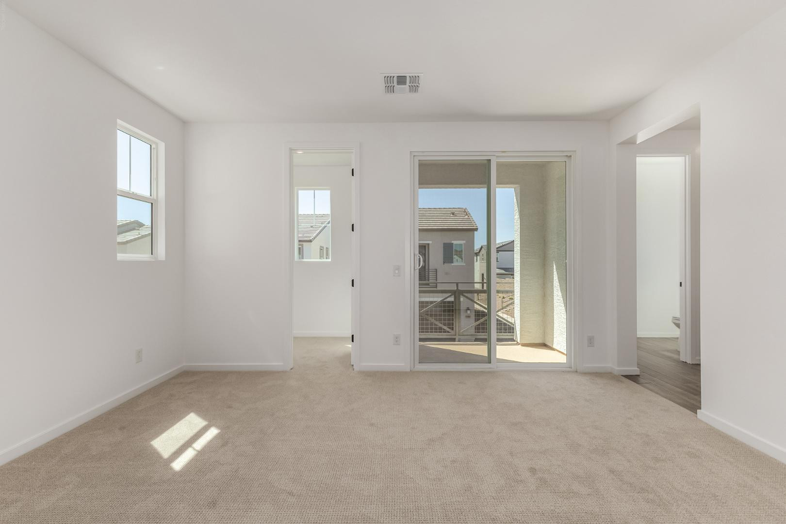 2434 West Maximo Way Phoenix, AZ 85085 - Photo 21 of 35 a view of an empty room with a window