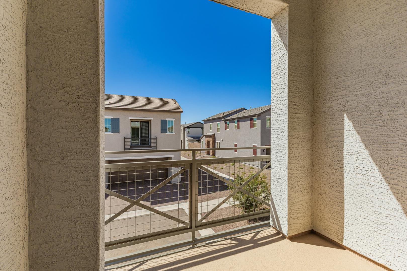 2434 West Maximo Way Phoenix, AZ 85085 - Photo 23 of 35 a view of a balcony with wooden floor and fence