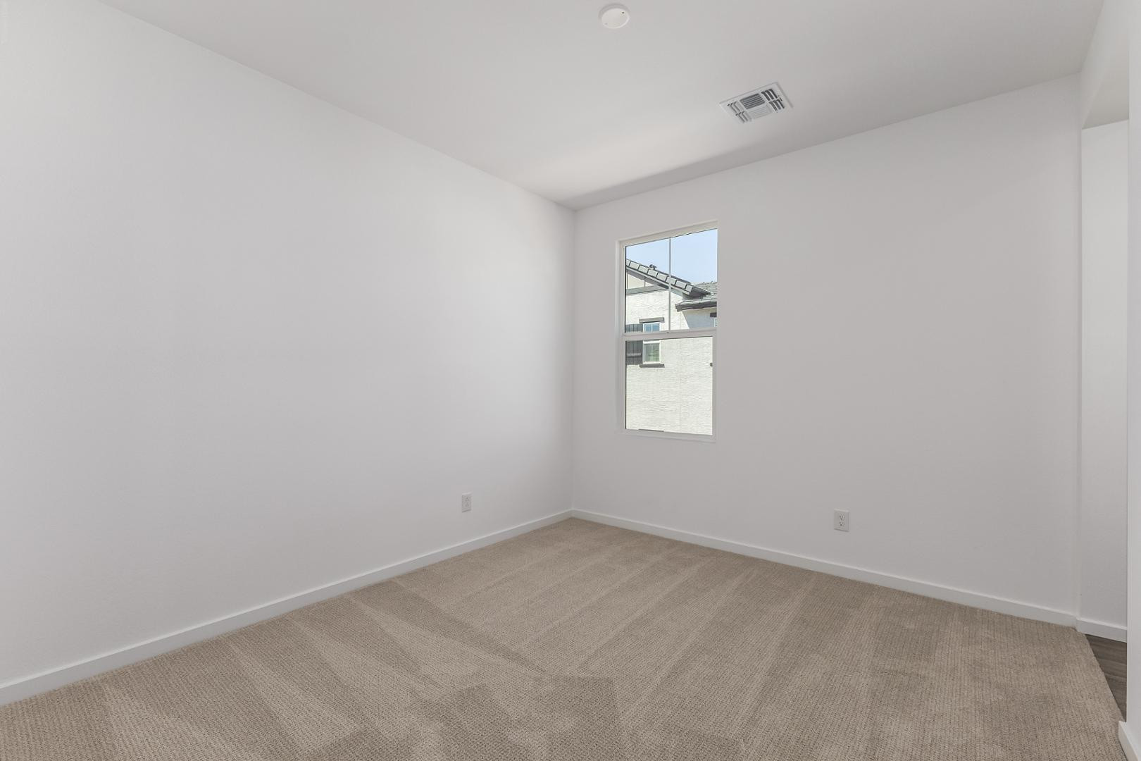 2434 West Maximo Way Phoenix, AZ 85085 - Photo 29 of 35 an empty room with windows
