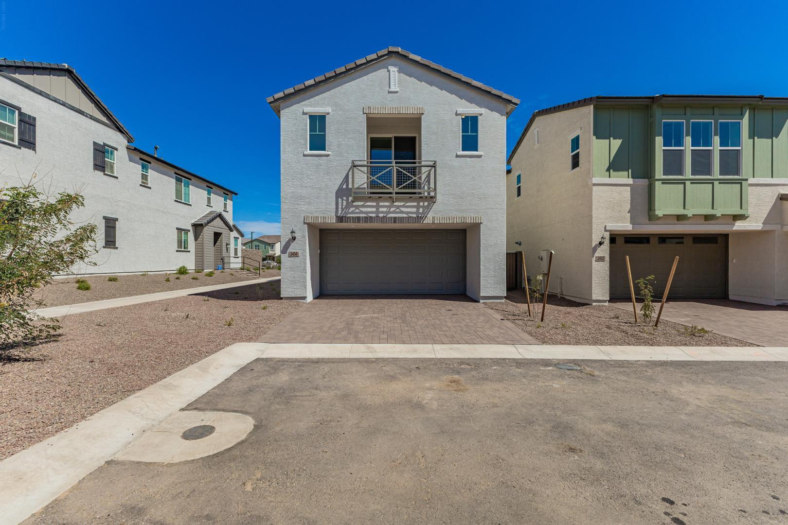 2434 West Maximo Way Phoenix, AZ 85085 - Photo 3 of 35 a front view of a house with a yard