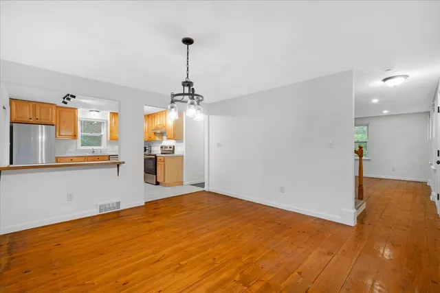 a view of a kitchen with a sink and a window