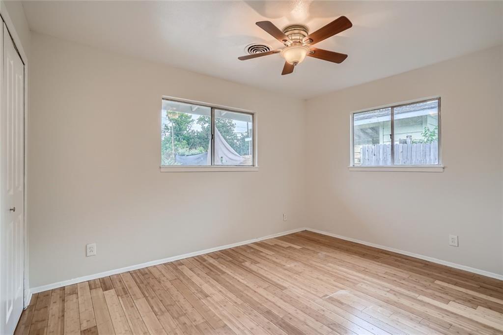 2101 Wheless Lane, Unit A Austin, TX 78723 - Photo 6 of 11 Spare room featuring light wood-style flooring and a ceiling fan