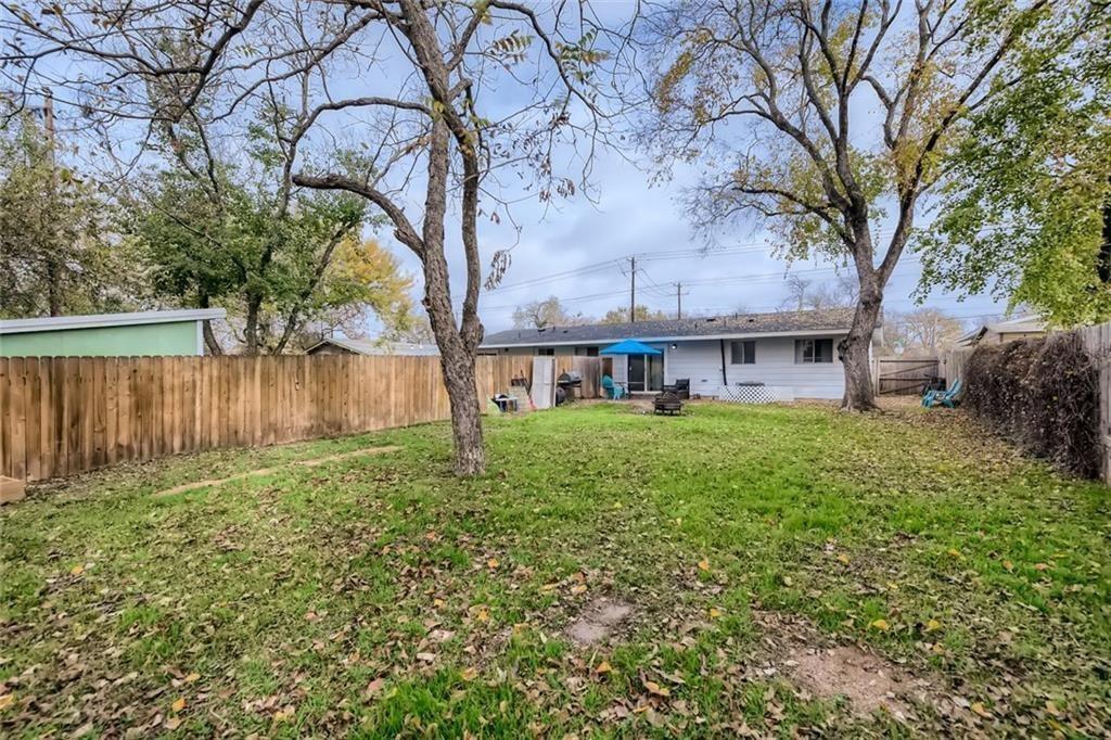 2101 Wheless Lane, Unit A Austin, TX 78723 - Photo 10 of 11 Rear view of house with a fenced backyard