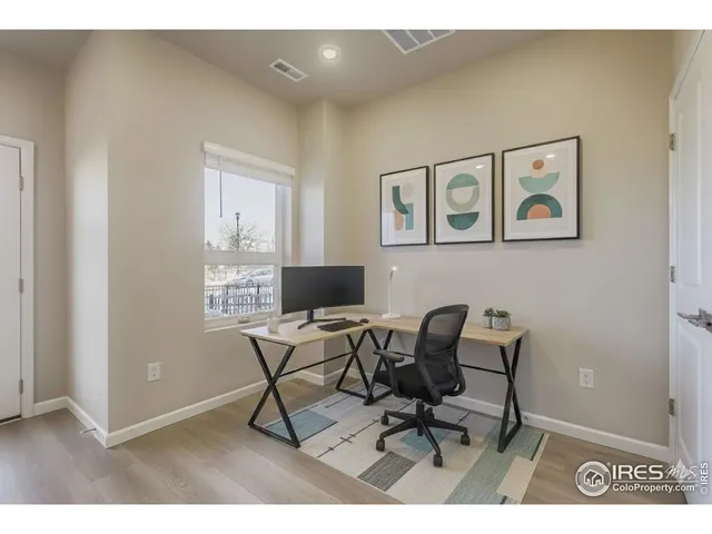 a workspace with furniture and a window