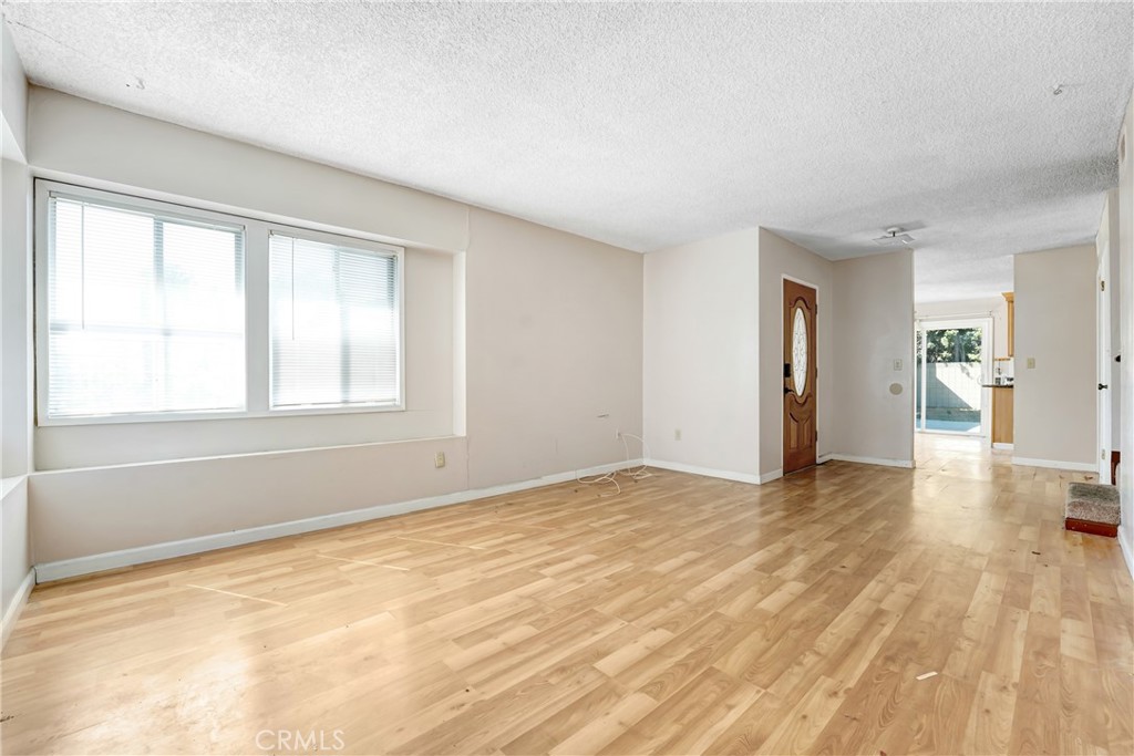 21801 Foley Avenue Carson, CA 90745 - Photo 2 of 10 a view of empty room with wooden floor and fan