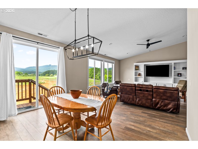 25850 Foster Road Monroe, OR 97456 - Photo 17 of 48 a view of a dining room with furniture window and wooden floor