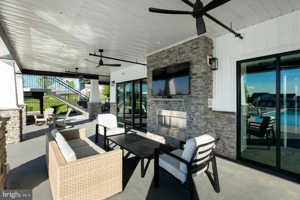 a living room with furniture a fireplace and a table