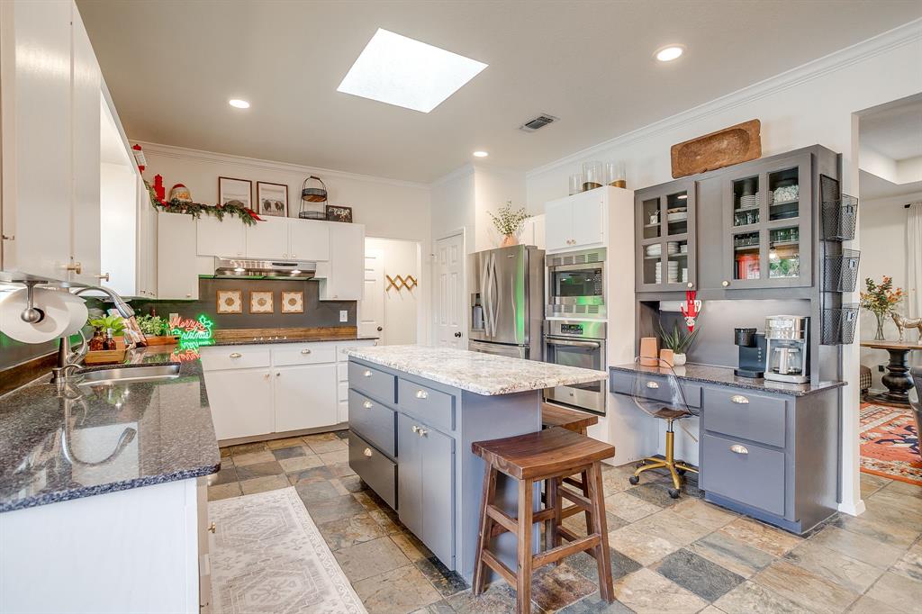 1930 Bethel Road Weatherford, TX 76086 - Photo 12 of 33 a room with furniture a flat screen tv and a table