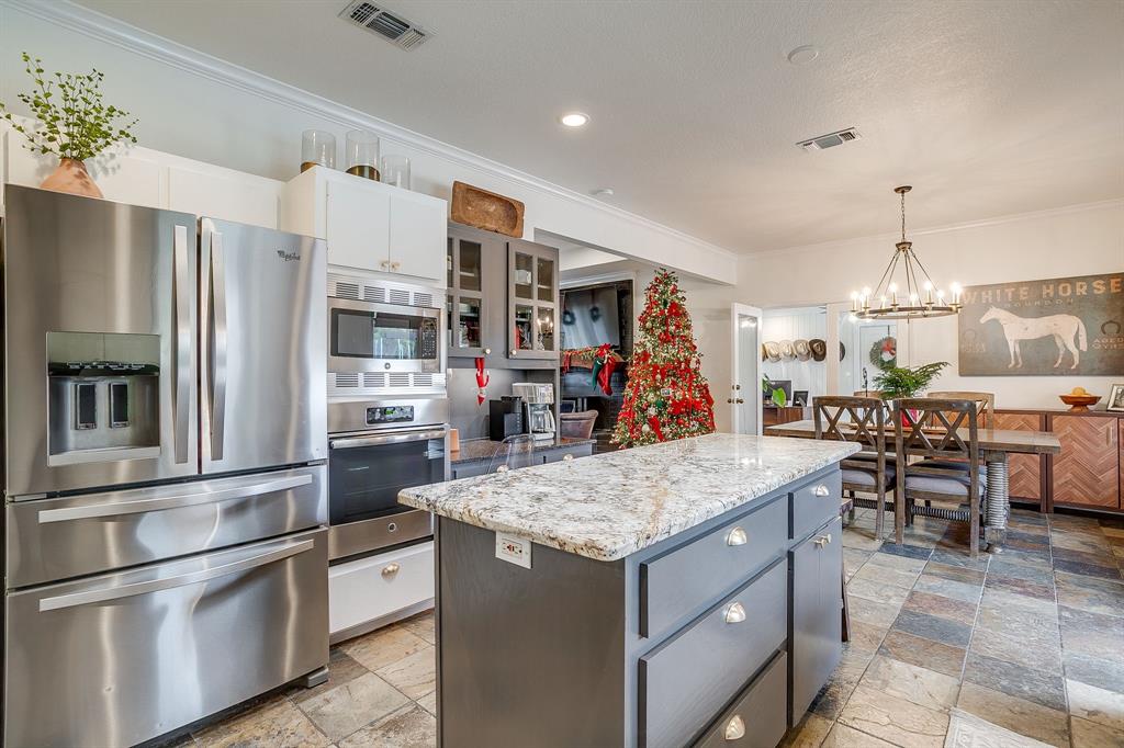 1930 Bethel Road Weatherford, TX 76086 - Photo 14 of 33 a kitchen with stainless steel appliances granite countertop a refrigerator and a sink