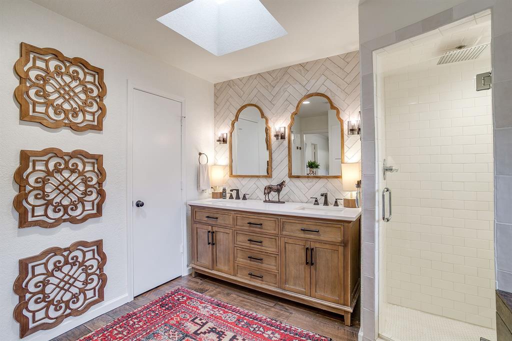 1930 Bethel Road Weatherford, TX 76086 - Photo 18 of 33 a large bathroom with a double vanity sink and a mirror