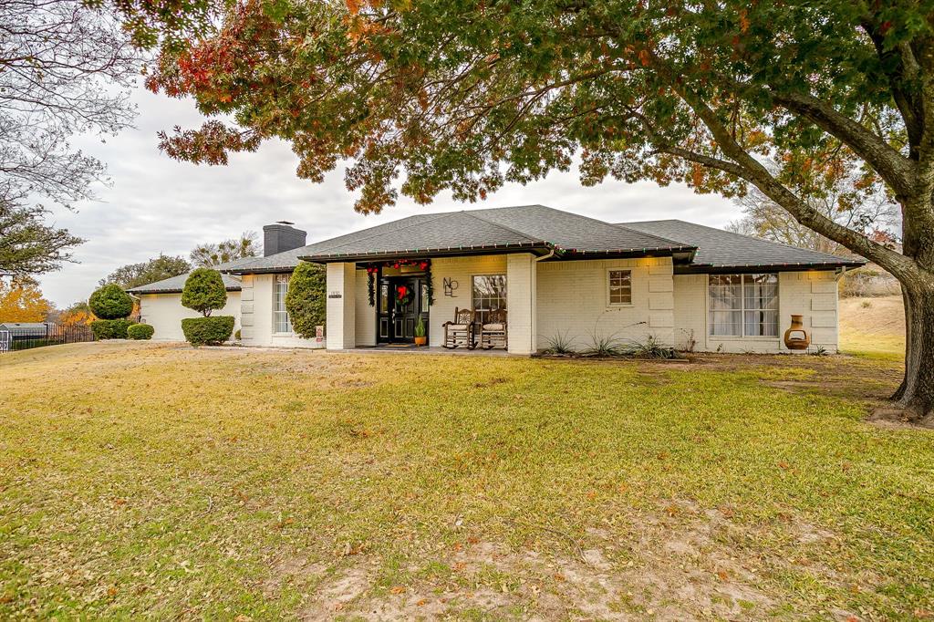 1930 Bethel Road Weatherford, TX 76086 - Photo 2 of 33 a view of a house with a yard and large tree