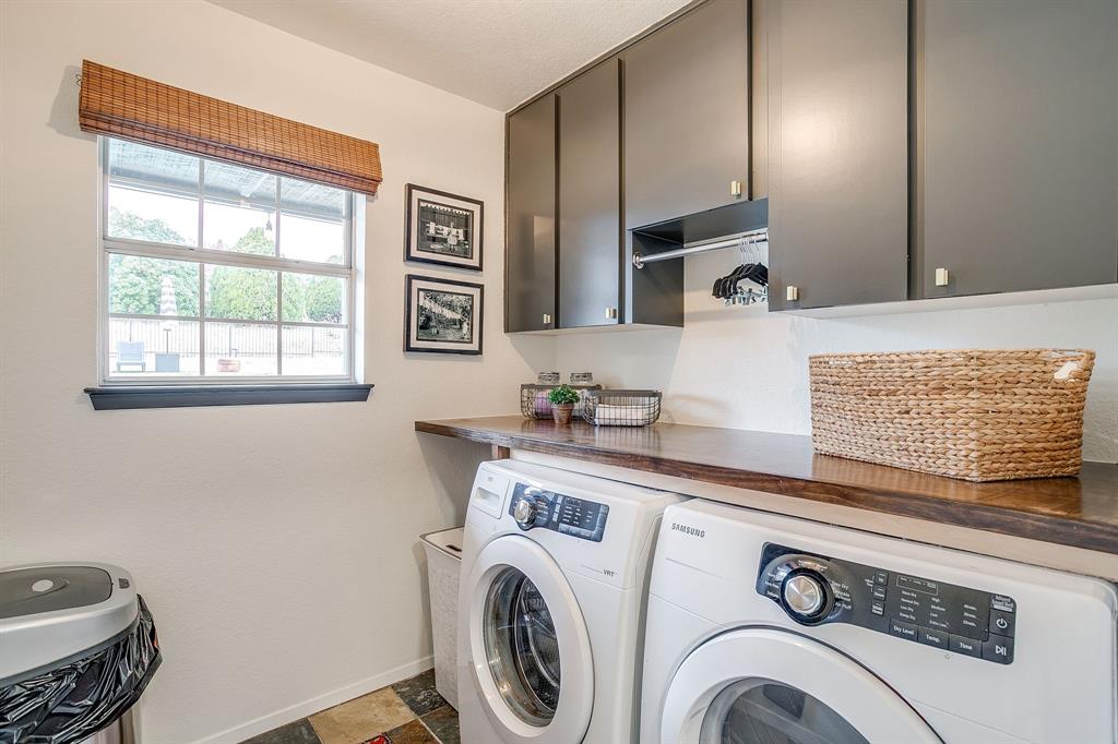 1930 Bethel Road Weatherford, TX 76086 - Photo 30 of 33 a view of washer and dryer with kitchen in the background