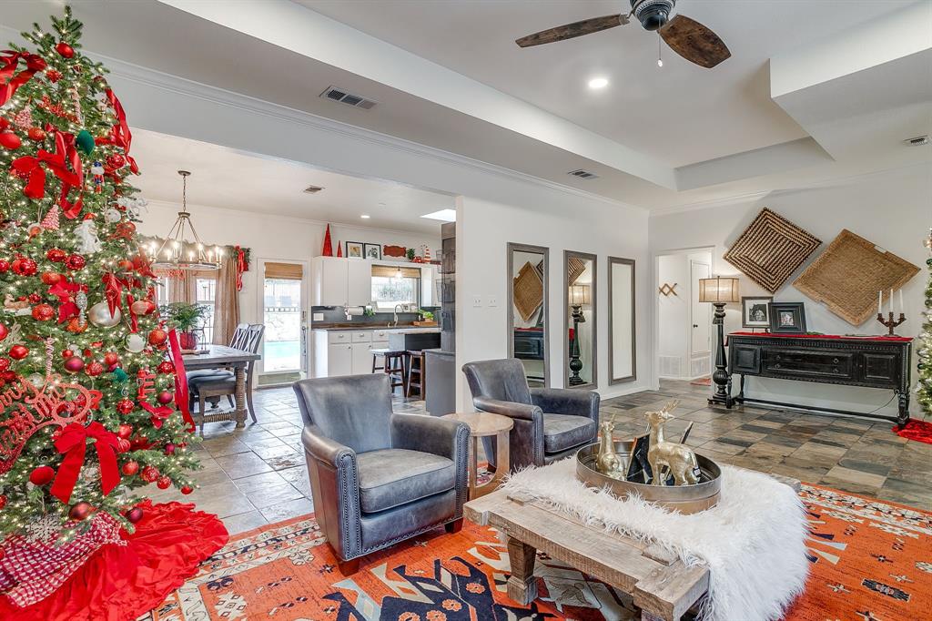 1930 Bethel Road Weatherford, TX 76086 - Photo 8 of 33 a living room with furniture and a chandelier