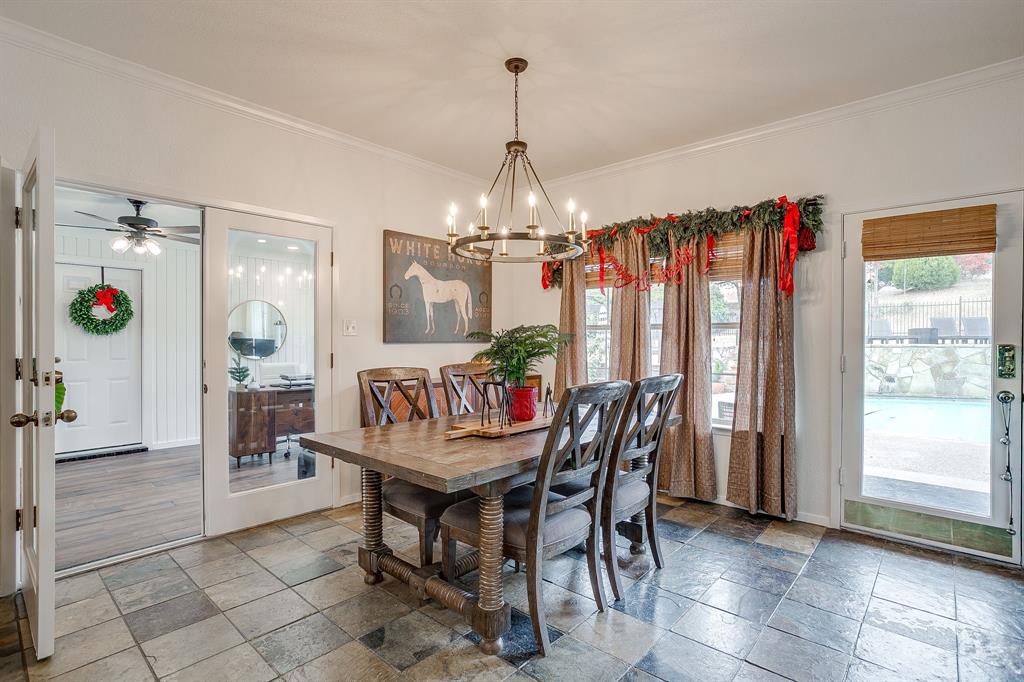 1930 Bethel Road Weatherford, TX 76086 - Photo 10 of 33 a view of a dining room with furniture and chandelier