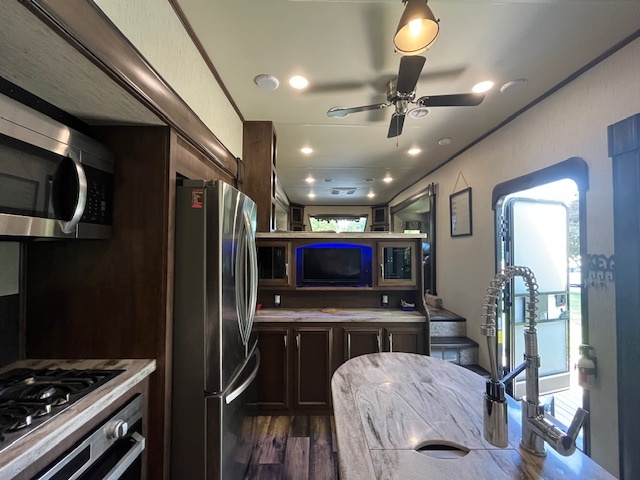 2795 East 28th Road Marseilles, IL 61341 - Photo 13 of 68 a kitchen with stainless steel appliances kitchen island granite countertop a stove and a refrigerator
