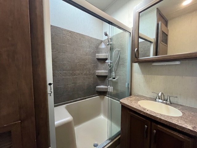 2795 East 28th Road Marseilles, IL 61341 - Photo 18 of 68 a bathroom with a granite countertop sink a toilet and shower