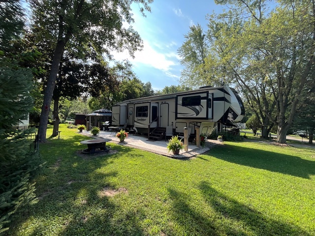 2795 East 28th Road Marseilles, IL 61341 - Photo 24 of 68 a view of a house with sitting area and a yard