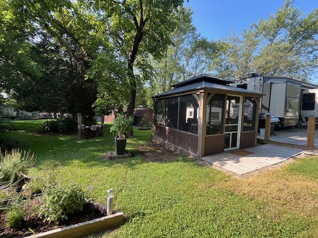 2795 East 28th Road Marseilles, IL 61341 - Photo 26 of 68 a view of a chair and table in backyard of the house