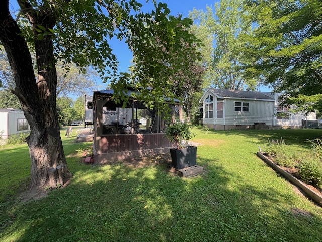2795 East 28th Road Marseilles, IL 61341 - Photo 27 of 68 a view of a house with backyard and sitting area