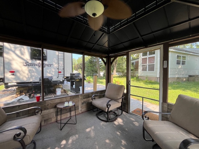 2795 East 28th Road Marseilles, IL 61341 - Photo 29 of 68 a living room with furniture and a floor to ceiling window