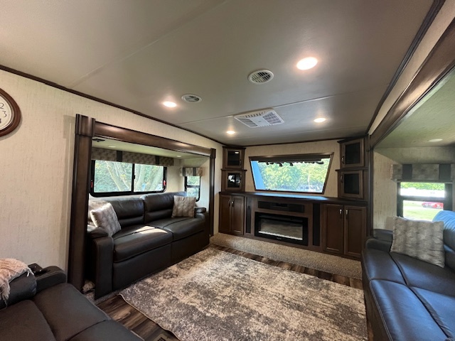 2795 East 28th Road Marseilles, IL 61341 - Photo 5 of 68 a living room with furniture a flat screen tv and a fireplace