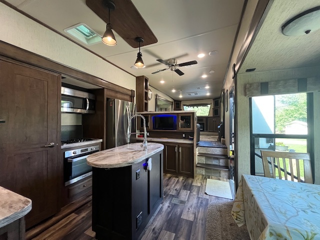 2795 East 28th Road Marseilles, IL 61341 - Photo 9 of 68 a kitchen with a table chairs refrigerator and microwave