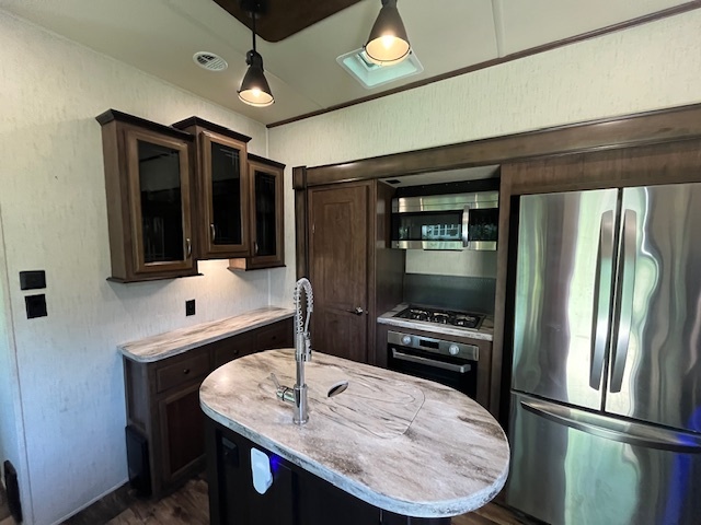 2795 East 28th Road Marseilles, IL 61341 - Photo 10 of 68 a kitchen with stainless steel appliances kitchen island granite countertop a refrigerator a stove and a sink with wooden floor