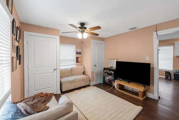 a living room with furniture and a large window