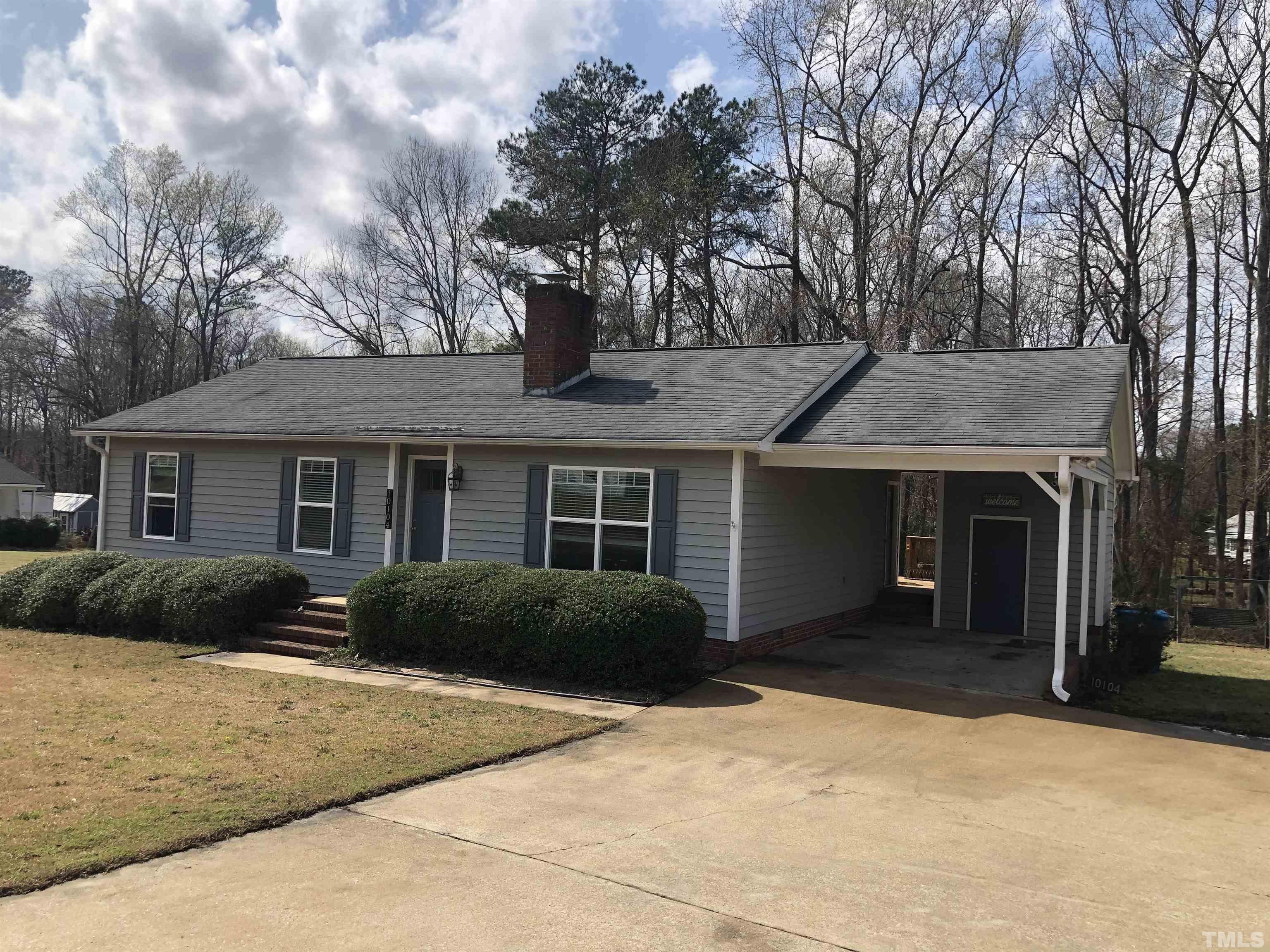 10104 Jordan Road Raleigh, NC 27603 - Photo 1 of 26 a front view of a house with a yard and garage
