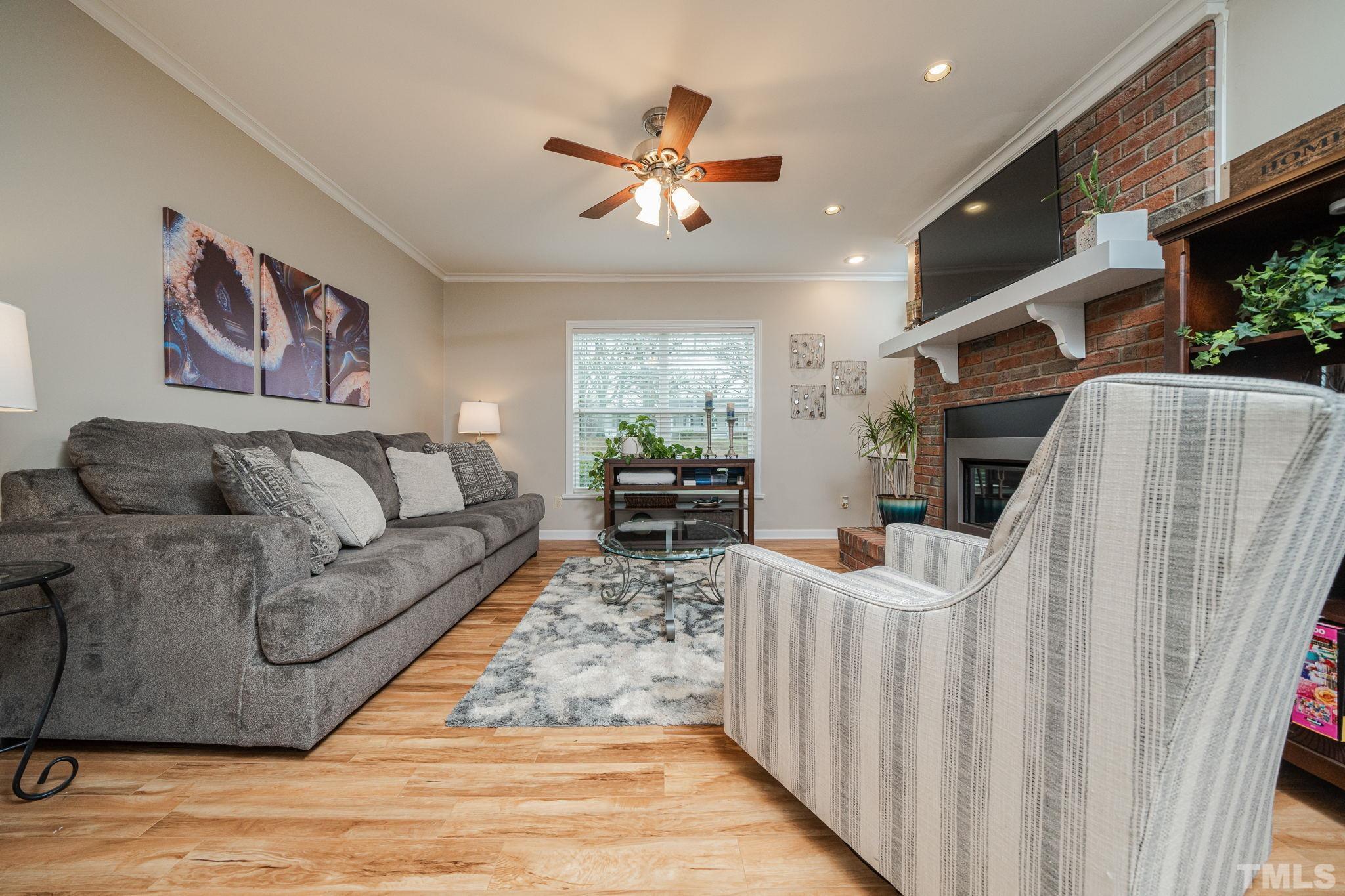 10104 Jordan Road Raleigh, NC 27603 - Photo 19 of 26 a living room with furniture and a fireplace