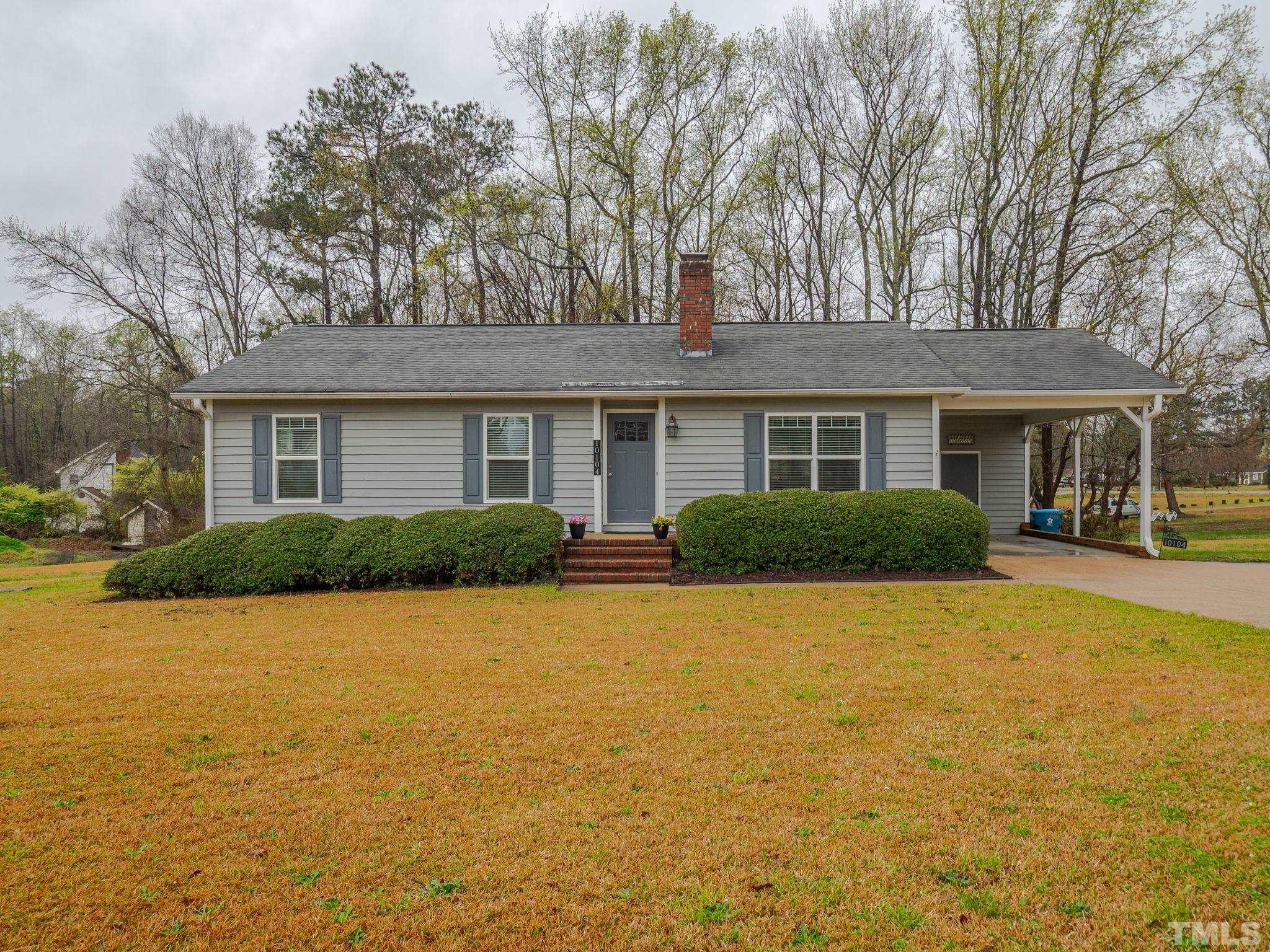10104 Jordan Road Raleigh, NC 27603 - Photo 3 of 26 a front view of a house with swimming pool and porch