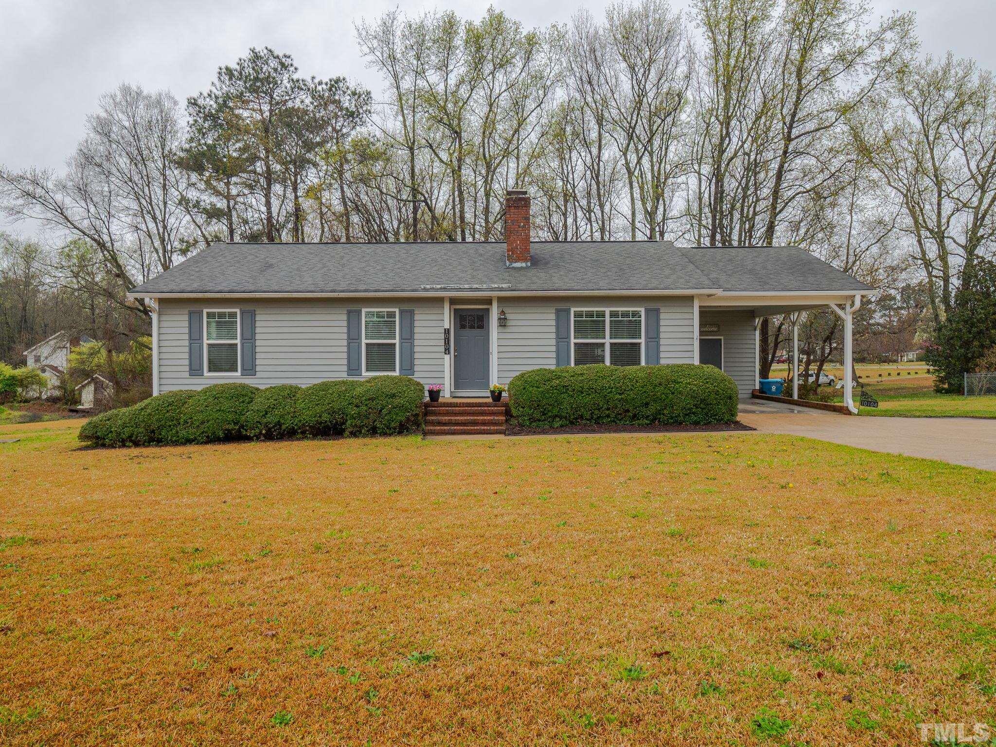 10104 Jordan Road Raleigh, NC 27603 - Photo 5 of 26 a front view of house with yard and trees around