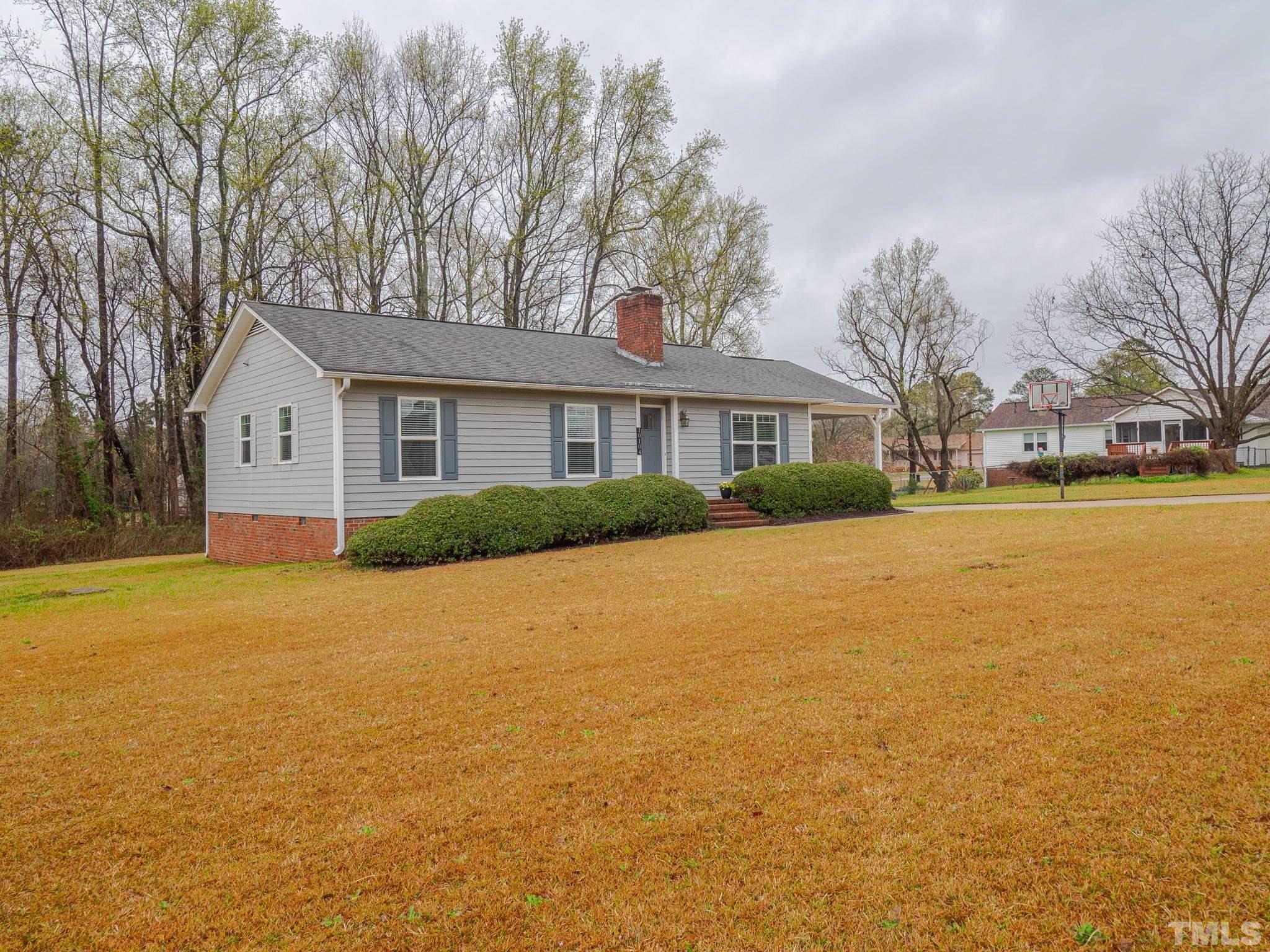 10104 Jordan Road Raleigh, NC 27603 - Photo 7 of 26 a front view of house with yard and trees around